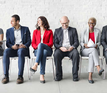 Business people sitting on chairs