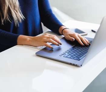 woman wearing on laptop