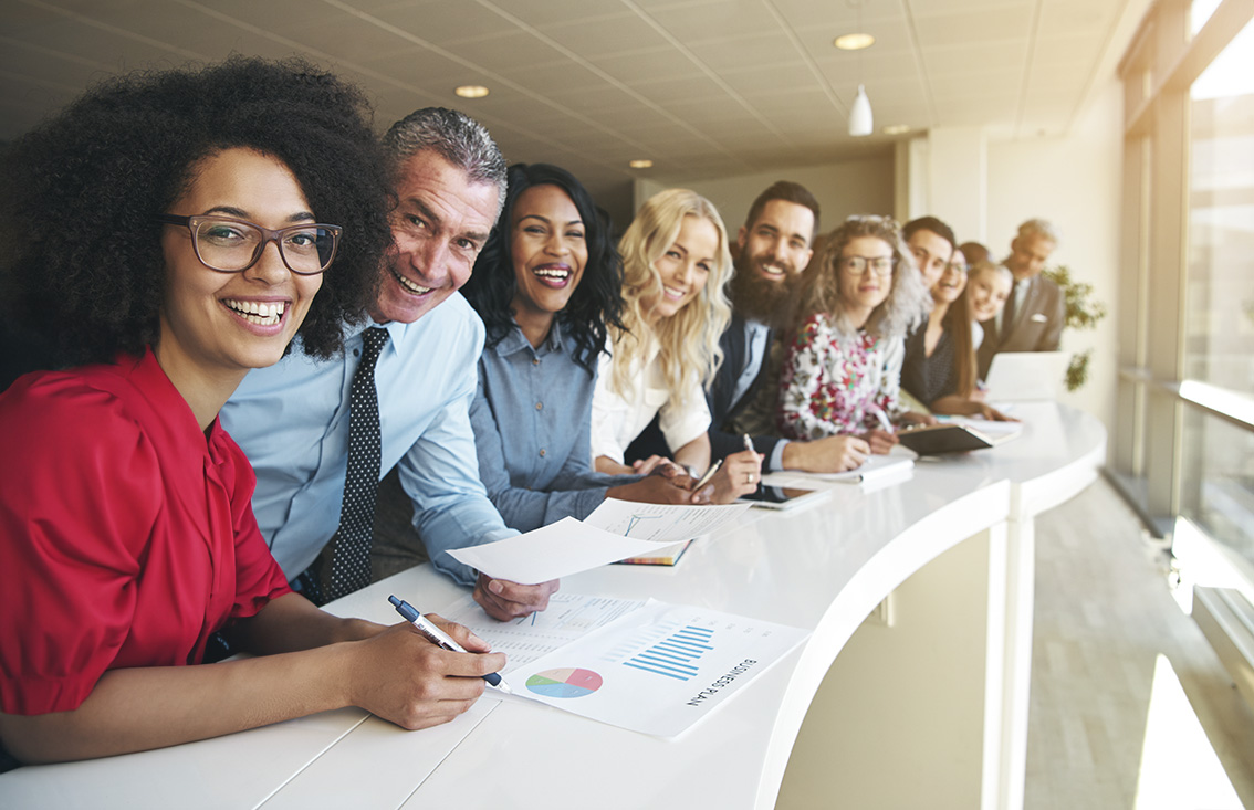 business people standing next to each other