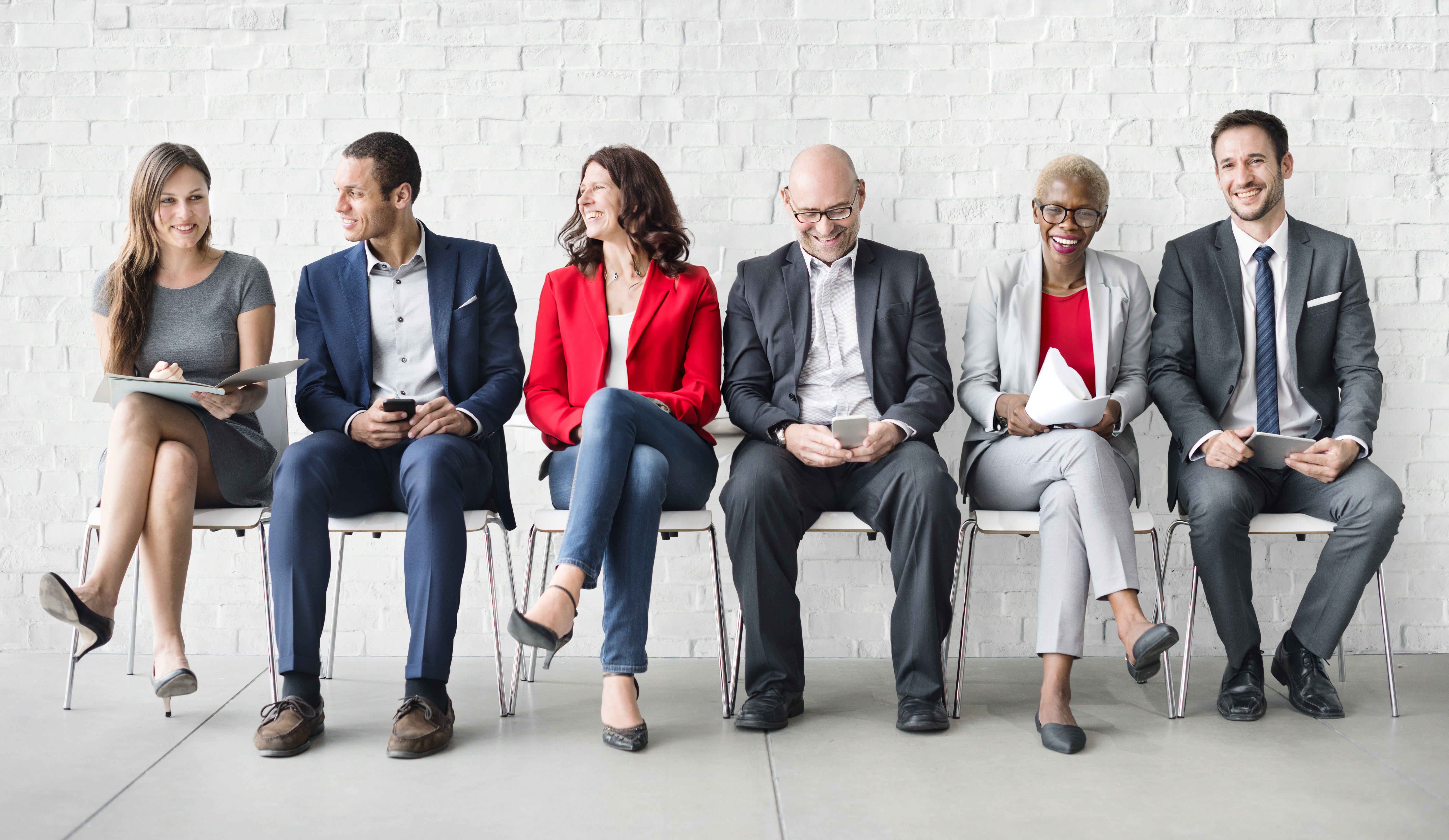 Business people sitting on chairs