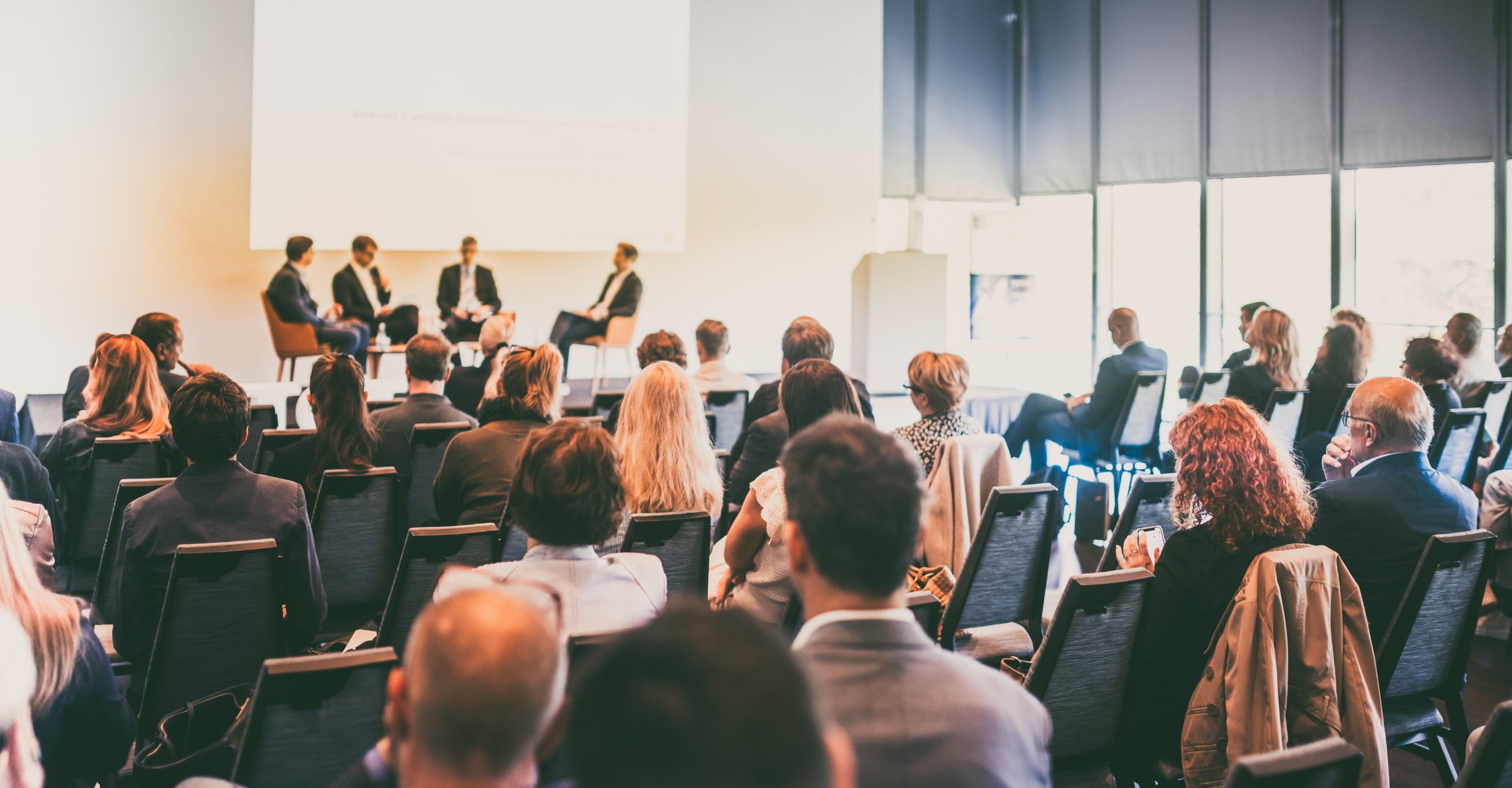 Business people attending a conference