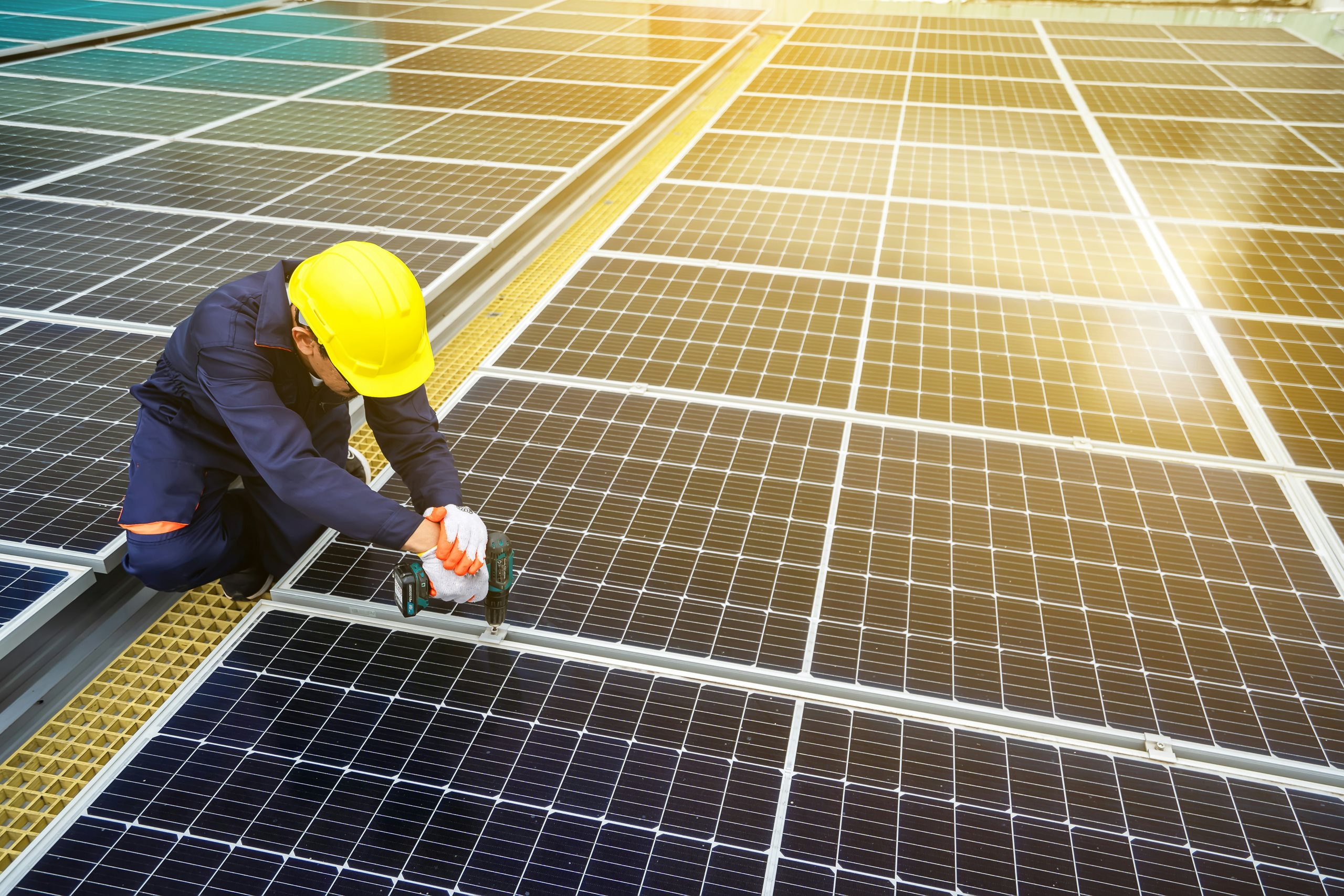 A worker working on photovoltaic panels